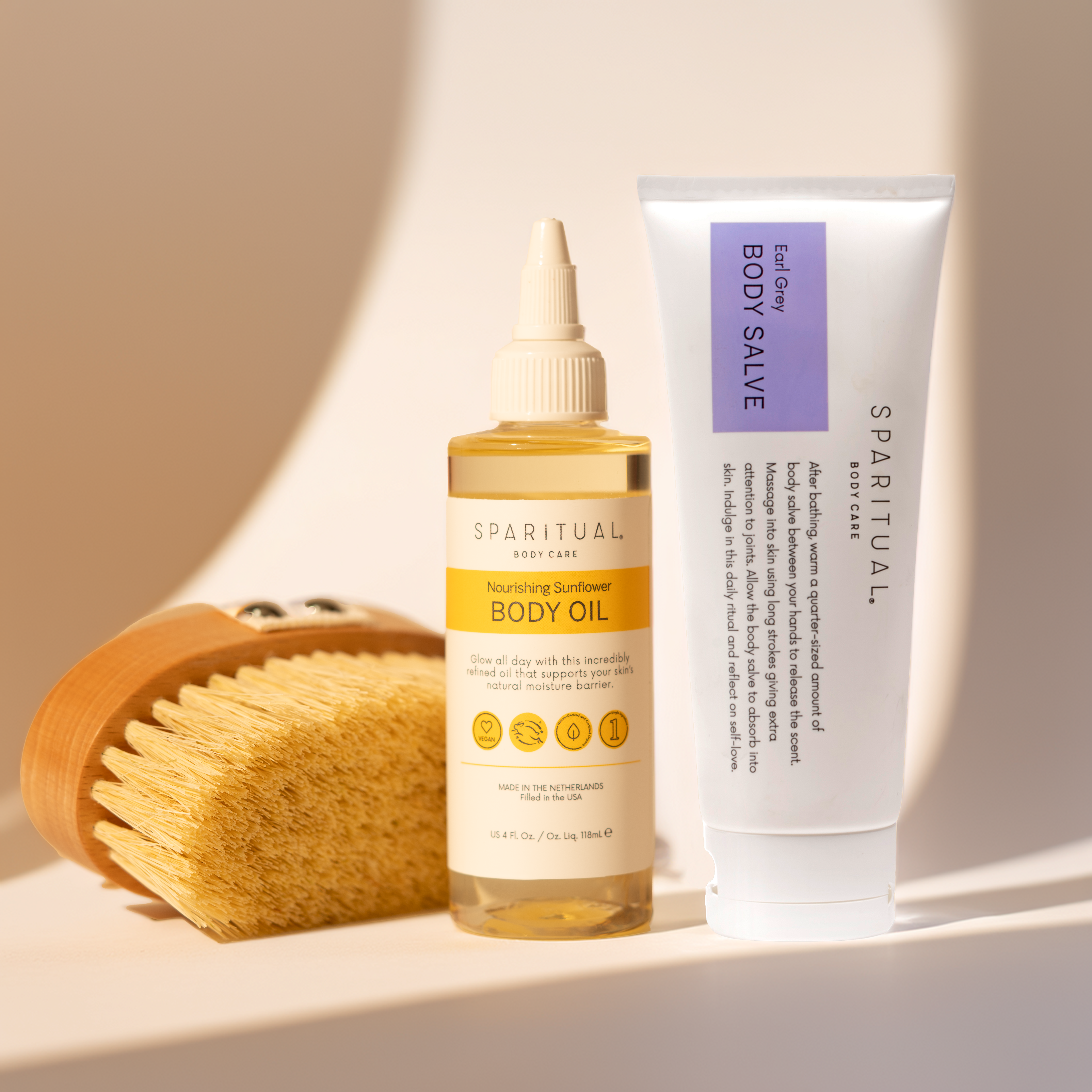 SPARITUAL Skincare Set Ayurvedic Abhyanga Massage at home featuring Vegan Dry Body Brush, Nourishing Sunflower Body Oil and Earl Grey Body Salve. Vegan, slow beauty, hydrating clean skincare