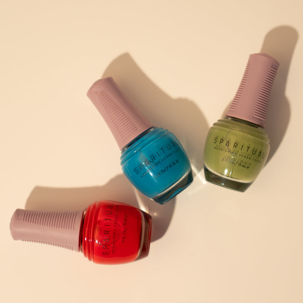 Nourishing Vegan Color collection featuring three nail polish shades. Vegan, cruelty-free, clean formula for healthy nails with 1-step application, no base or top coat needed.
